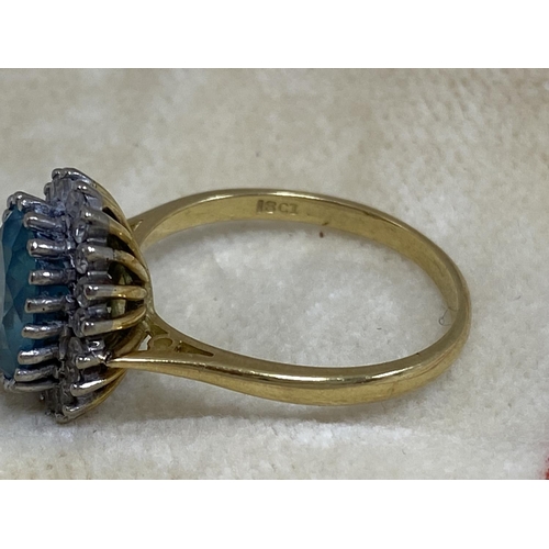 7 - 18ct Gold Aquamarine/Diamond Ring. Approx 2 carat with 20 Surrounding Diamonds. 5.6 Grams Size R