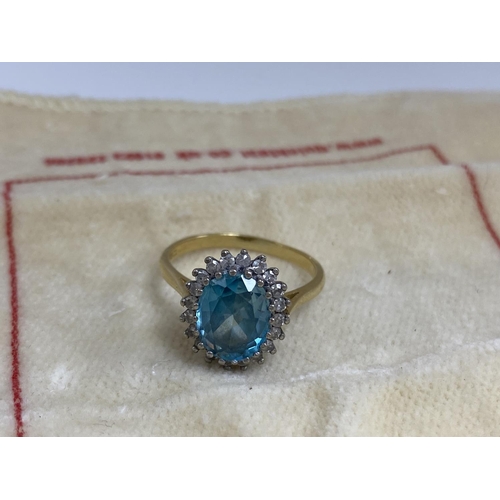 7 - 18ct Gold Aquamarine/Diamond Ring. Approx 2 carat with 20 Surrounding Diamonds. 5.6 Grams Size R