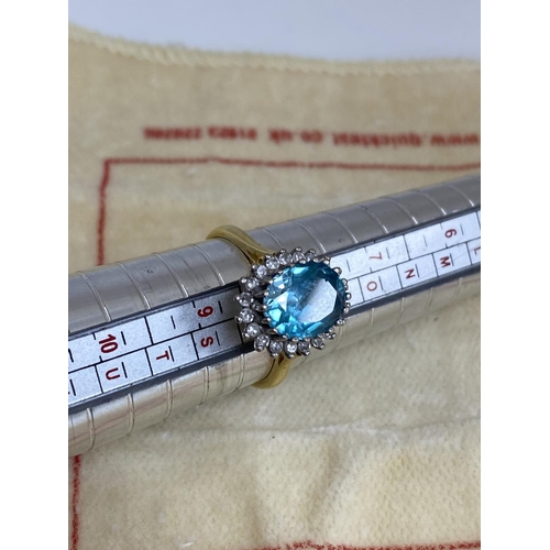 7 - 18ct Gold Aquamarine/Diamond Ring. Approx 2 carat with 20 Surrounding Diamonds. 5.6 Grams Size R