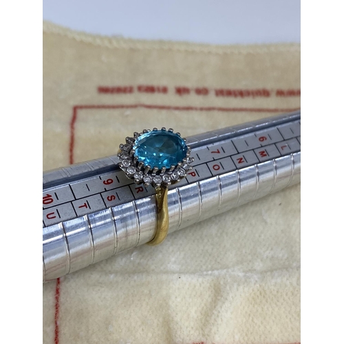 7 - 18ct Gold Aquamarine/Diamond Ring. Approx 2 carat with 20 Surrounding Diamonds. 5.6 Grams Size R