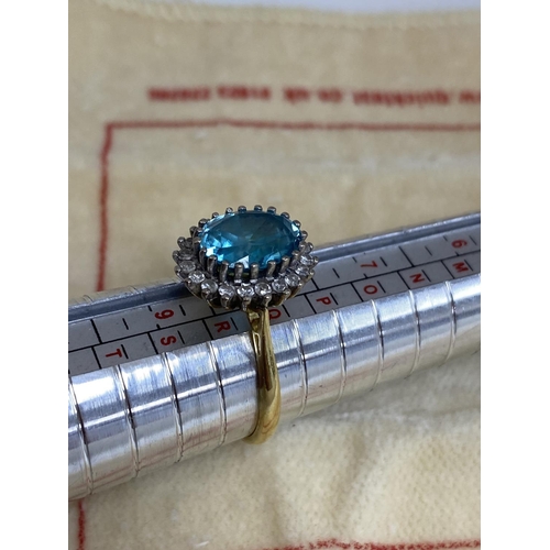 7 - 18ct Gold Aquamarine/Diamond Ring. Approx 2 carat with 20 Surrounding Diamonds. 5.6 Grams Size R