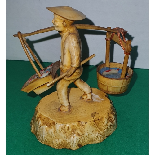 44 - Small handmade oriental fisherman figurine