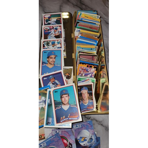 125 - Tin containing a large qty of vintage baseball / American football cards plus a mini Yankees basebal... 