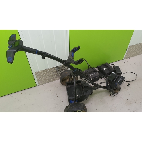 676 - A motocaddy motorised golf trolley with batteries etc.