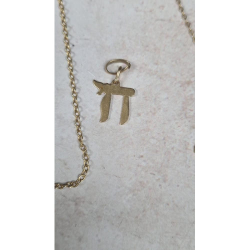 110 - 9ct Gold Crucifix on a Chain, a 9ct Gold Chai Hai Charm (4.7g) and a Yellow Metal Sarah Coventry Nec... 