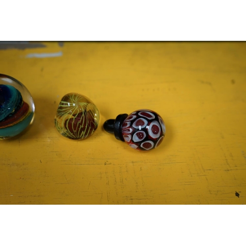 477 - 3 Glass Paperweights and a Bottle Stopper