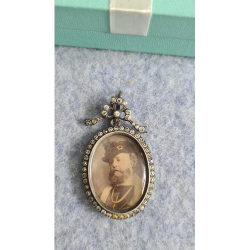 22 - White Metal Mourning Pendant-Portrait to the Front and Curl of Hair to the rear