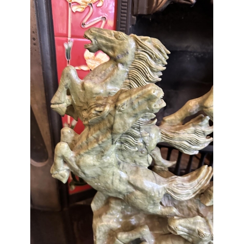 243 - A Fine Vintage Chinese Carved Jade Sculpture Depicting Galloping Horses. 60cm x 50cm