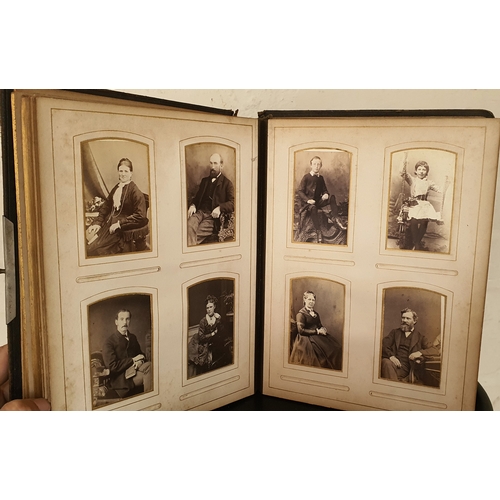 11 - A very old album containing a good quanity of old photographs and portraits etc