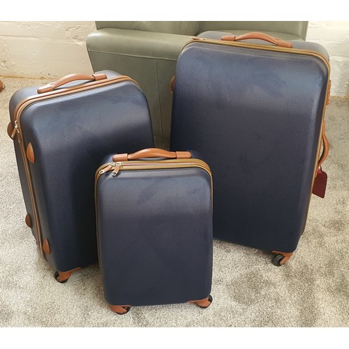 58 - Set of 3 good quality 4-wheel hard shell trolley suitcases