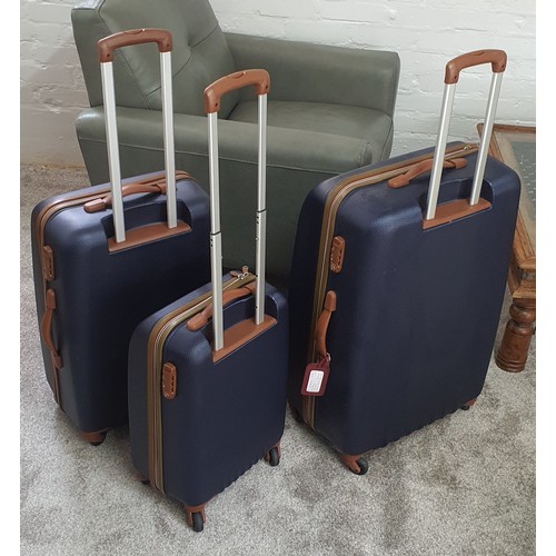 58 - Set of 3 good quality 4-wheel hard shell trolley suitcases