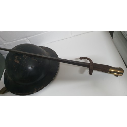 17A - A old military helmet plus a vintage bayonet