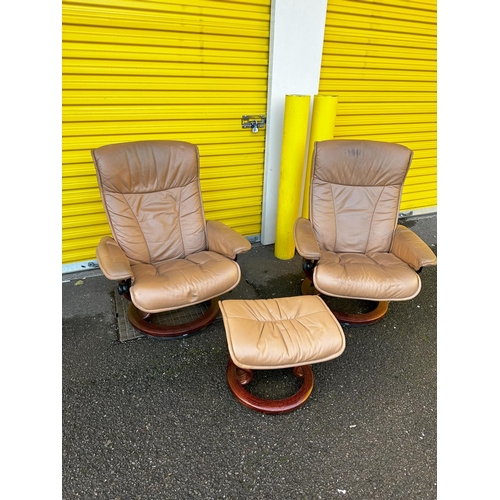 893 - A Pair of Vintage Ekornes Stressless Reclining Armchairs and Foot Stools