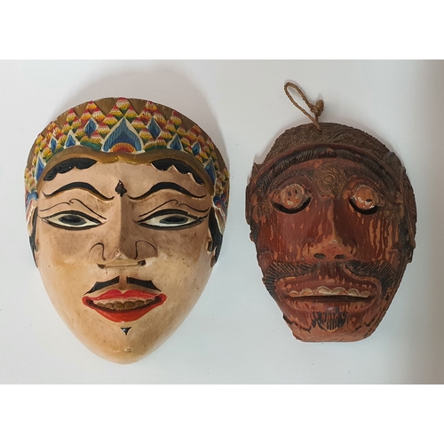 76 - Vintage handpainted Bali carved mask plus one other old mask