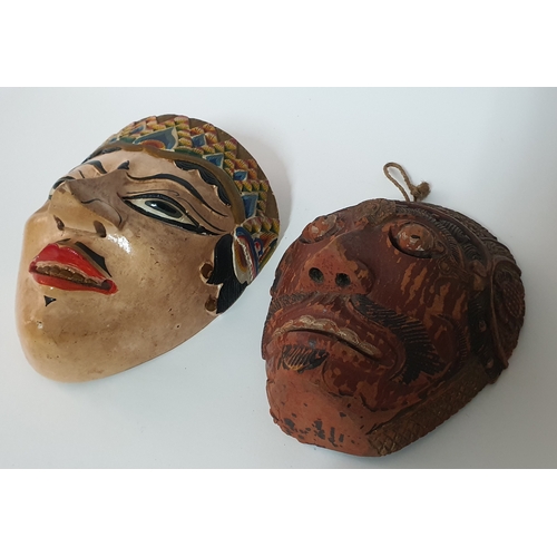 76 - Vintage handpainted Bali carved mask plus one other old mask