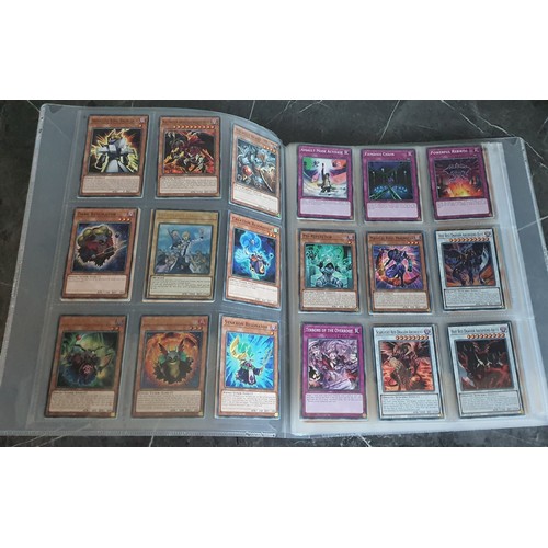 138 - Album containing a large qty of Yu-gi-oh trading cards Inc first editions plus a qty of Pokemon card... 