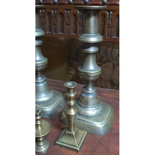 157 - Pair of vintage brass candle sticks and four smaller