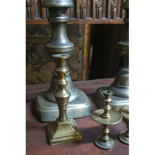 157 - Pair of vintage brass candle sticks and four smaller