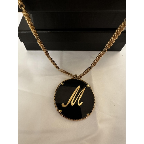 32 - 9ct Gold Mounted Pendant on a 9ct Gold Chain (total Weight 61g)