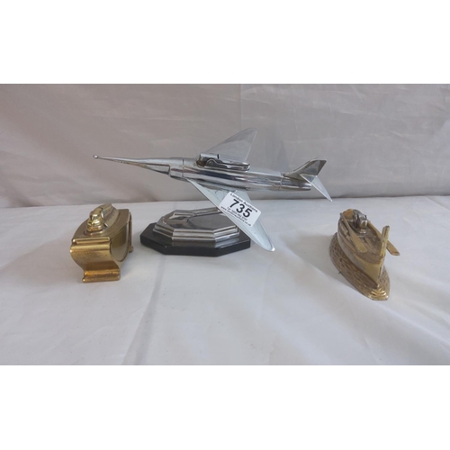 735 - Vintage Plane Form Lighter plus two other table lighters