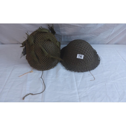 746 - Two WW2 helmets.  Tommy Helmet with net and Paratrooper helmet