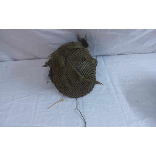 746 - Two WW2 helmets.  Tommy Helmet with net and Paratrooper helmet