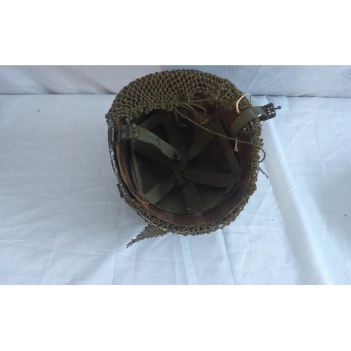 746 - Two WW2 helmets.  Tommy Helmet with net and Paratrooper helmet