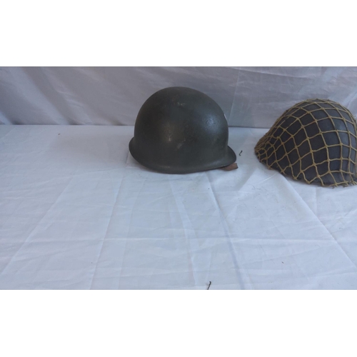 748 - WW2 Brodie Helmet with Camo net and a WW2 helmet