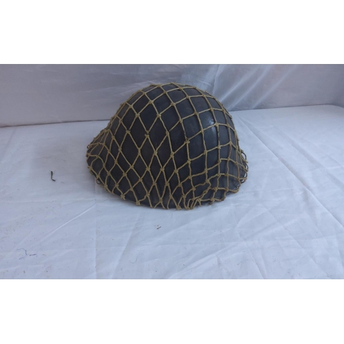 748 - WW2 Brodie Helmet with Camo net and a WW2 helmet