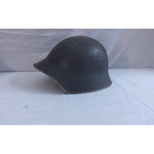 750 - Swiss WW2 M18 Helmet, American M1 Helmet and a Homefront FAP Helmet