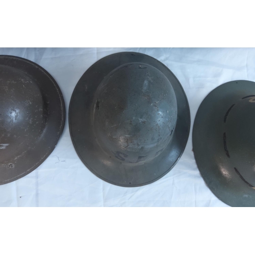 751 - British Mkii Brodie Helmet, plus two Street Fire Party Helmets