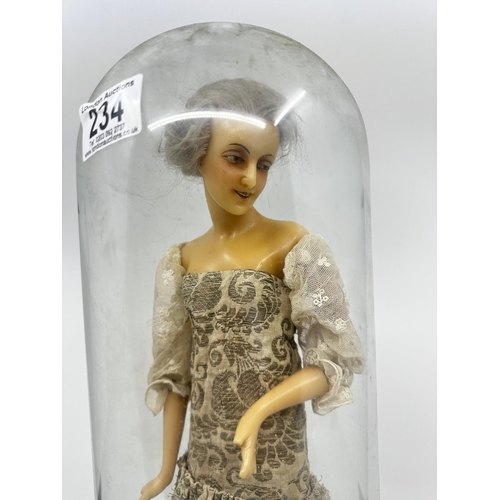 234 - Old Wax Doll on a Wooden Stand in a Glass Dome