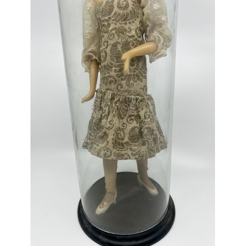 234 - Old Wax Doll on a Wooden Stand in a Glass Dome