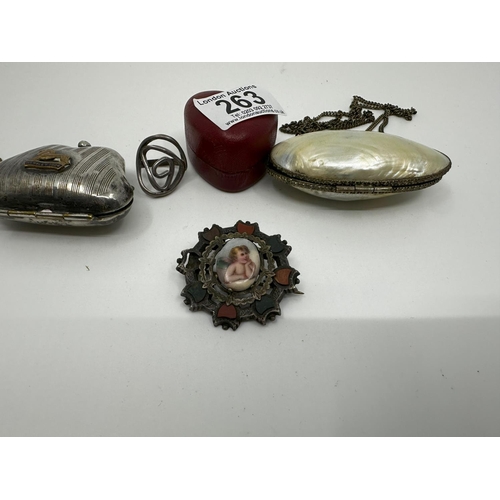 263 - Silver Ring, White Metal Putti Brooch, British Empire Exhibition Stamp Purse and a Shell Purse