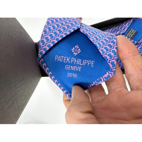 414 - New Patek Philippe Silk Tie and an Omega Pocket Knife