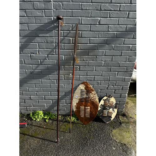 241 - Two 19th Century Zulu Cow Skin Shield (72cm x 43cm), Zulu Staff (165cm) and Zulu Spear (153cm)