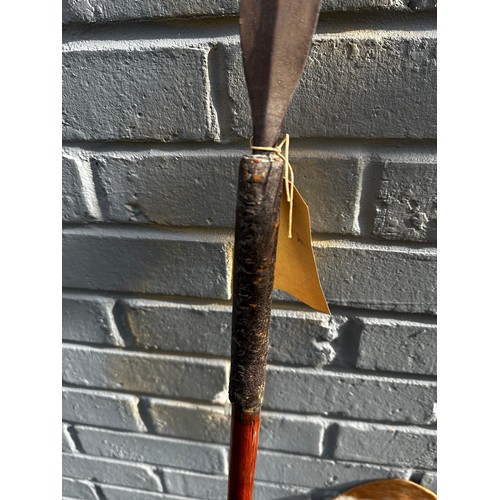 241 - Two 19th Century Zulu Cow Skin Shield (72cm x 43cm), Zulu Staff (165cm) and Zulu Spear (153cm)