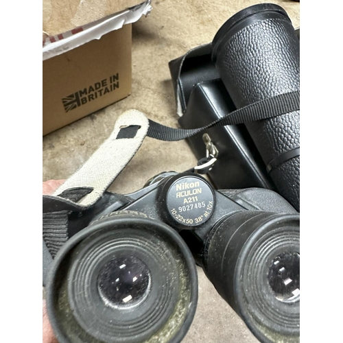 1342 - Pair of Kronos 20x60 binoculars in a case and a Pair of Nikon Aculon A211 Binoculars