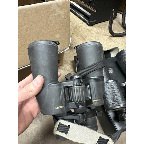 1342 - Pair of Kronos 20x60 binoculars in a case and a Pair of Nikon Aculon A211 Binoculars