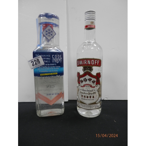 1228 - 70cl bottle of Smirnoff vodka and 70cl Gilbeys London dry gin.