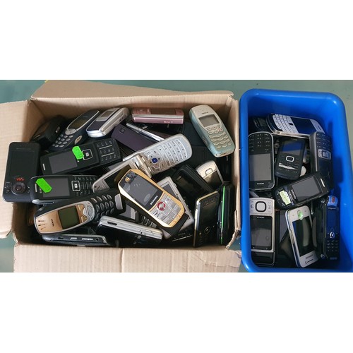 194 - 2x boxes of a selection of old mobile phones - includes Nokia, Blackberry etc