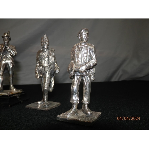 153 - Four Pewter Military Figurines