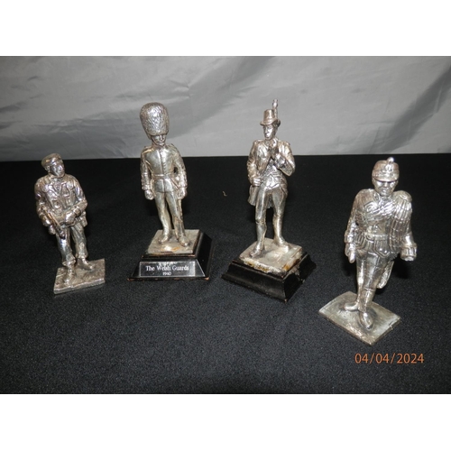 153 - Four Pewter Military Figurines