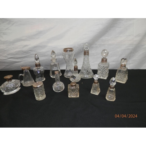 154 - Good Lot of Cut Glass Bottles mostly with Silver Collars