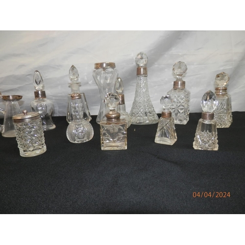 154 - Good Lot of Cut Glass Bottles mostly with Silver Collars