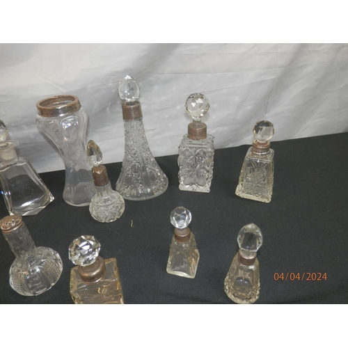 154 - Good Lot of Cut Glass Bottles mostly with Silver Collars