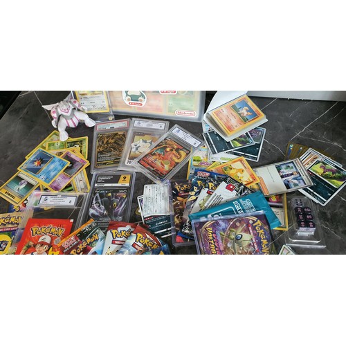 9 - Album containing approx 100 Pokemon Cards, Various graded cards and unopened packs etc.