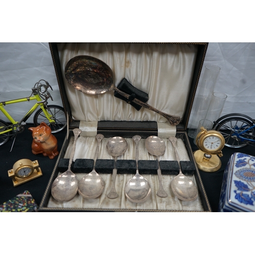 196 - A mixed lot including crystal, Ceramic & Brass Figurines, Bud Vases and Silver Plate