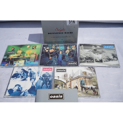 316 - Original Oasis Singles Boxset: Definitely Maybe 1996