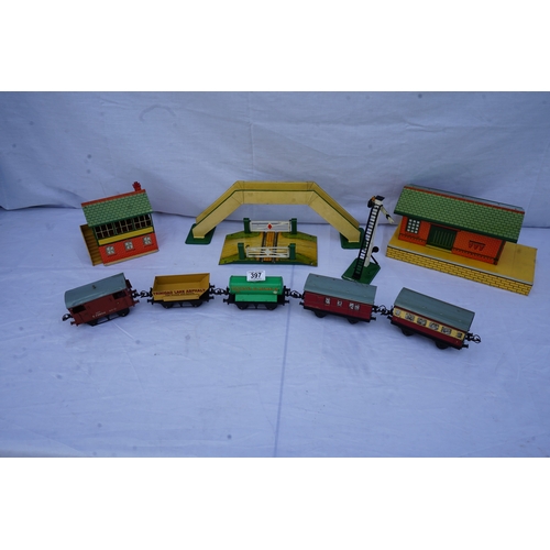 397 - Hornby: A collection of O Gauge Trains and Scenery Items . Each Piece is Individually Boxed in its o... 